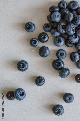 Fresh blueberry on a grey table. Concept for healthy eating and nutrition. Antioxidant organic superfood