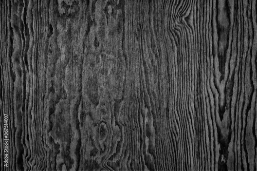Black larch plywood surface texture. Wooden pattern. Dark wood background