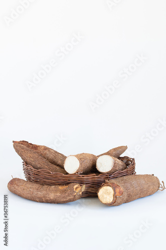 Fresh Cassava root isolated on a white background. Space copy.