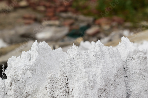 White porous structures. Sharp edges. Concept of chemical waste and reagents, dump of salt, alkali.