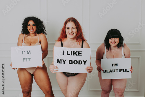 Body acceptance concept. curvy girl posing in studio against society prejudice