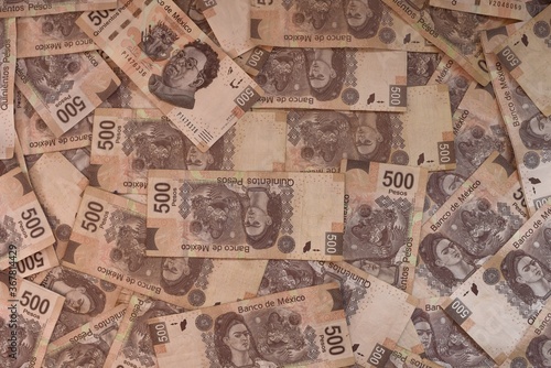 Overhead shot of 500 peso banknotes in a pile