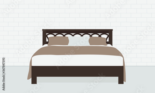 Double bed on brick wall background