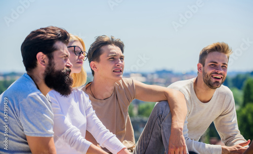 Hang out together. True friendship. Spending time with friends. Summer vacation. Cheerful friends communicating. Men and woman talking nature background. Youth relaxing. Carefree friends concept
