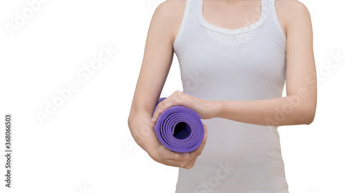 Asian woman holding her yoga mat isolated on white background with with clipping path. Yoga and meditation have good benefits for health.
