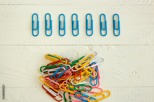 colored paper clips on the white backrground, perfectionism
