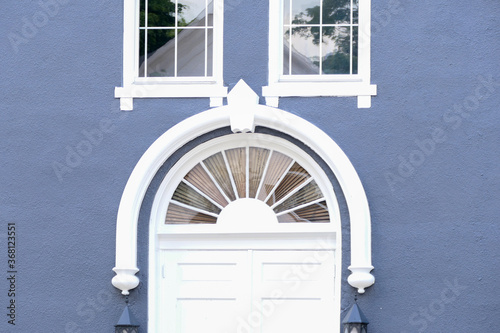 white transom window on a blue building