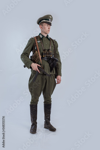 Male actor reenactor in historical uniform as an officer of the German Army during World War II