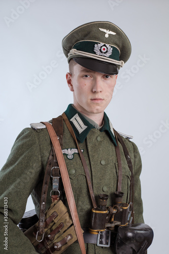 Male actor reenactor in historical uniform as an officer of the German Army during World War II