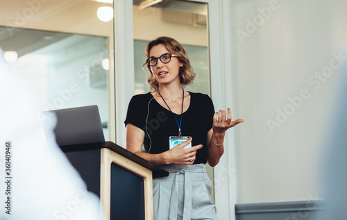 Businesswoman delivering a speech during a conference