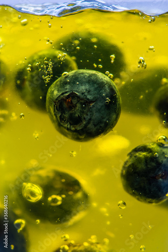 Background with blueberries in yellow jelly.