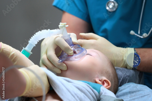 Preparing a child for dental surgery. General anesthesia. Treatment of multiple caries of baby teeth. Copy of the space.