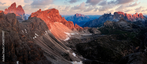 Sunrise panorama of dolomites feat. Tre cime di lavadero, paterno and Croda Rossa d’Ampezzo with spectacular alpine glow