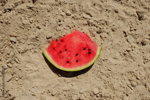 Skiba watermelon on the sand. Food at sea