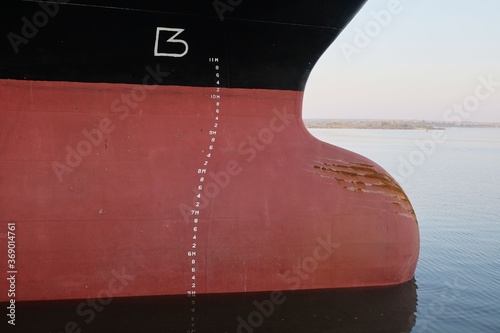 Cargo ship bulbous bow view with draft marks