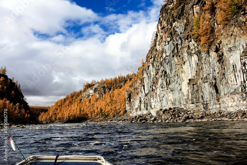 Rise of a Siberian river in a rocky gorge in the fall.