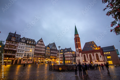 Medieval historical buildings at old town square Römerberg with Justitia statue in Frankfurt, Germany.