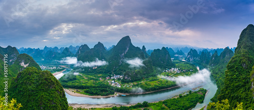Landscape of Guilin, Li River and Karst mountains. Located near Yangshuo County, Guilin City, Guangxi Province, China. Green nature background picture, panoramic picture.