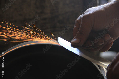 Sparks grinding wheel while knife sharpening