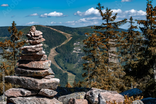 Rock balancing in Sudetes mountains landscape