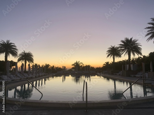 Reflective pool under a dusky sunset