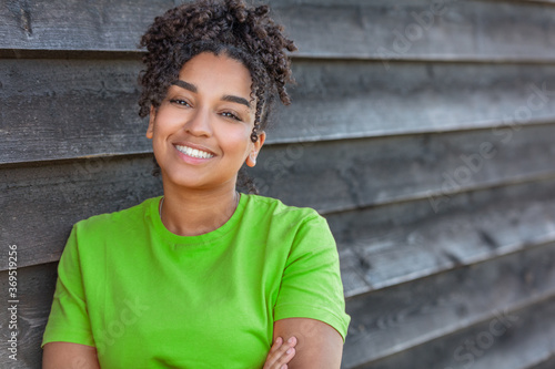 Girl teenager teen female young African American woman outside smiling with perfect teeth