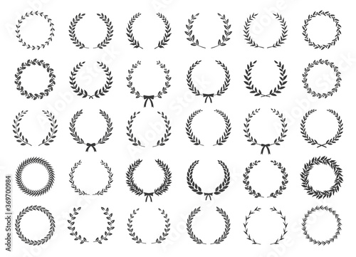 Set of black and white silhouette circular laurel foliate and oak wreaths depicting an award, achievement, heraldry, nobility. Vector illustration.