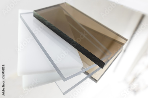 Solid Polycarbonate Sheet. Brown, white, transparent. Acrylic Plastic glass