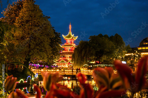 illuminated Chinese pagoda in a danish park at night