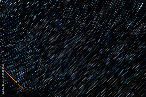 star trails in the night sky. clear evening sky