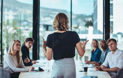 Businesswoman sharing new ideas in meeting