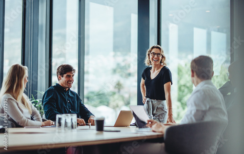 Business people having casual discussion during meeting