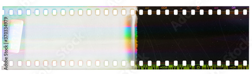 Beginning of 35mm negative film strip, first frame on white background, real scan of film material with funny scanning light interferences on the film material. 