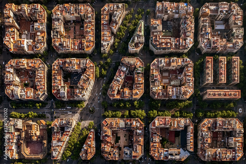 Aerial view of typical buildings of Barcelona cityscape from helicopter. top view, Eixample residencial famous urban grid