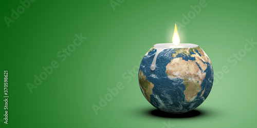 Bougie en forme de Terre pour symboliser le réchauffement climatique ou la consommation des ressources naturelles