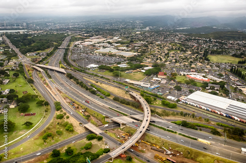 Aerial view of cityscape and nearby infrastructure. Location is O'ahu island, Hawaii, USA