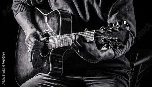 Music concept. Guitar acoustic. Play the guitar. Live music. Music festival. Instrument on stage, band. Electric guitar, guitarist, musician rock. Musical instrument. Guitars, strings. Black and whit