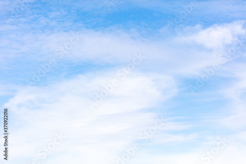 White clouds on a blue sky as background