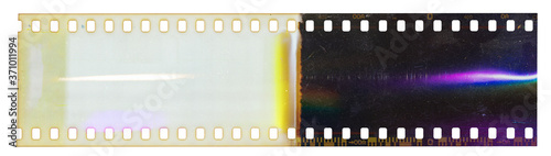 Start of 35mm negative filmstrip, first frame on white background, real scan of film material with cool rainbow scanning light interferences on the material. 