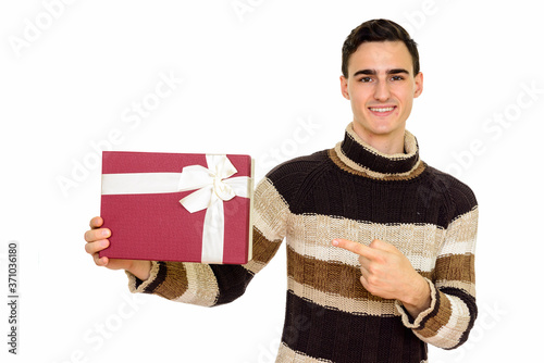 Portrait of happy young handsome man ready for Christmas