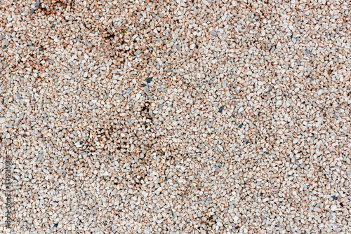 Abstract texture with fine beige gravel