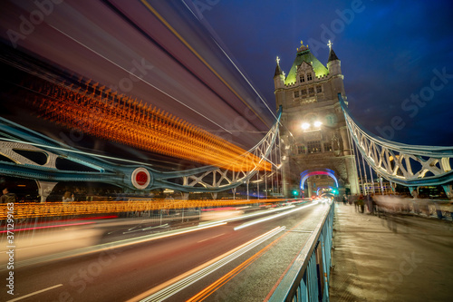 Tower Bridge and traffic light at twilight in London, UK