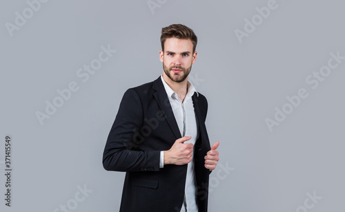 Confident and stylish. sexy ceo on gray background. modern office life. charismatic business owner. stylish realtor. handsome man wear formal suit. confident businessman in shirt jacket. boss male