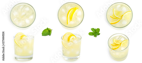Glass with lemon lemonade and ice on a white background. . High quality photo
