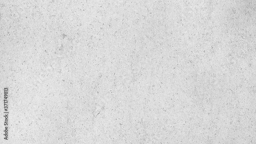 Monohrome grainy gray abstract background. Grunge plastered wall texture, concrete cement background.