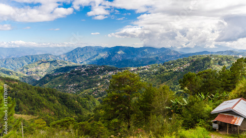 View of subdivisions and houses on mountainous terrain at the outskirts of Baguio City.