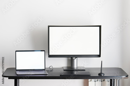 Desk with laptop and computer monitor