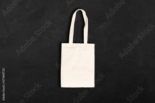 Shopping canvas or cotton bag on concrete background. Mock-up for branding. 