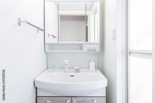 close-up white basin in modern bathroom