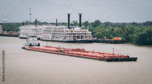 Barge in river, industrial and cargo transportation